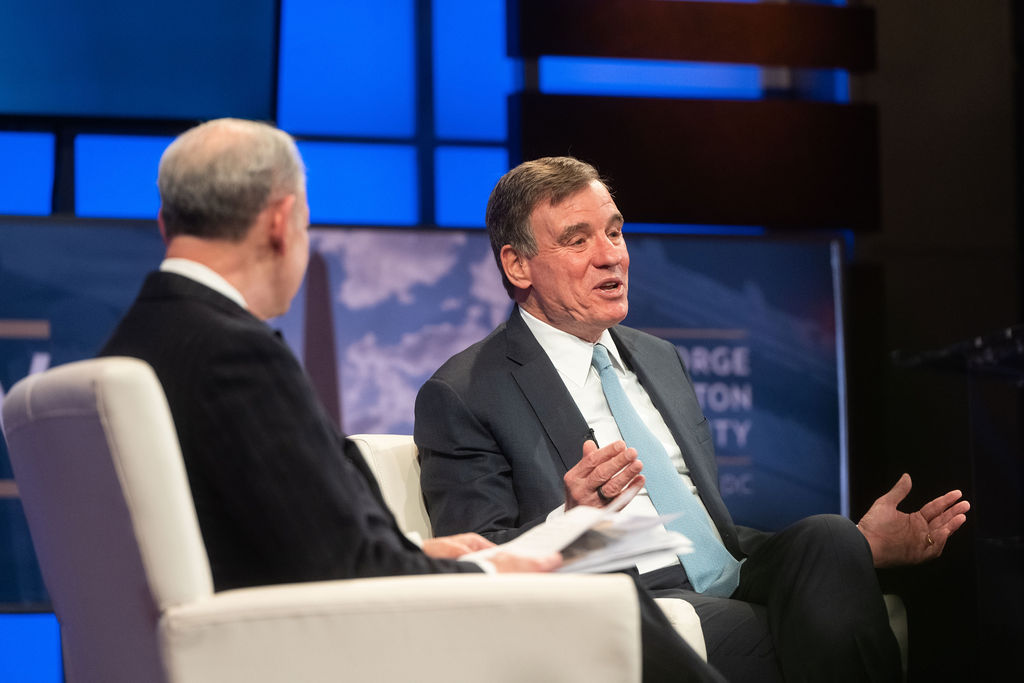 Interview on stage between 2 people at 2023 business policy forum